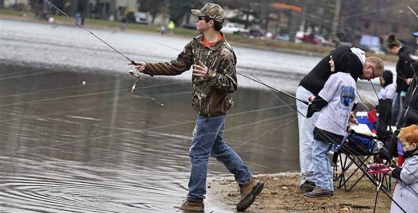 Tyler Holben, 18, has some fun competing in the 2016 Toledo Trout Derby in this photo by ToledoBlade.com. Tyler – who primarily focuses his angling career on bass fishing – is a Christian and enjoys competing in his sport while wearing Christian T-shirts and hoodies from Kerusso.