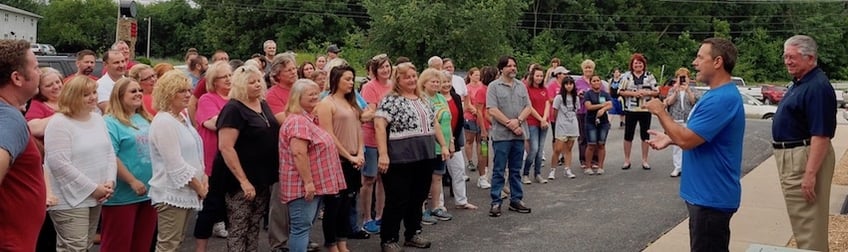 Retiring Kerusso Director of HR Bob Ahart, far right, and Founder & CEO Vic Kennett, second from right, speak to Kerusso team members during a send-off party on Ahart's final day at work. He will be missed!